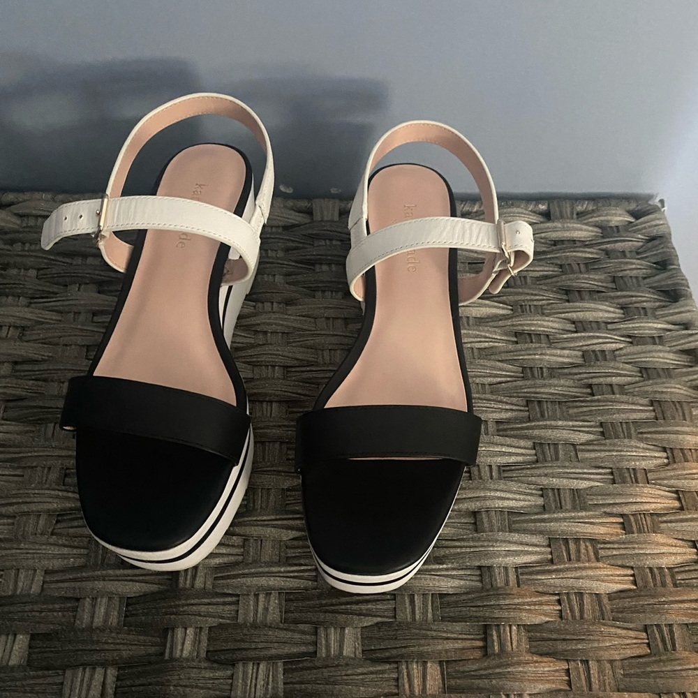 KATE SPADE black and white platform sandals.